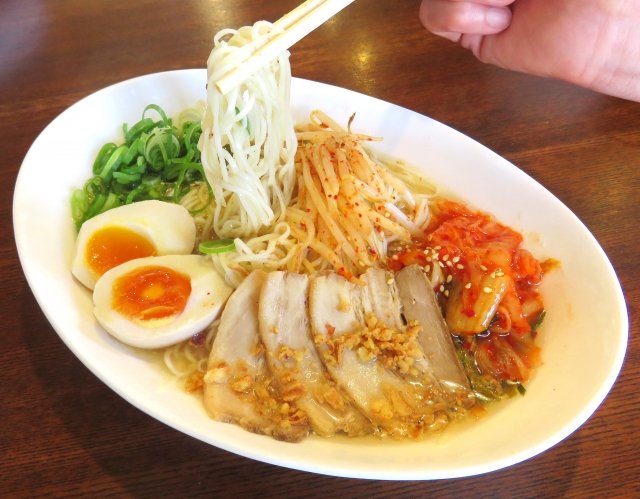 Strange Customs and Culture in Japan making a sound eating noodle