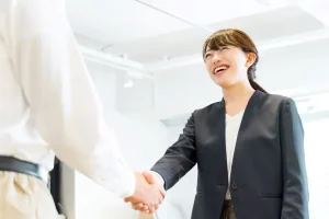 Japanese tutor shaking hands